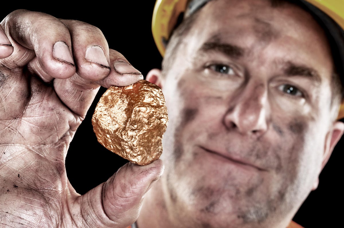 man gold mining